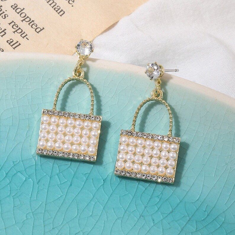 White purse earring